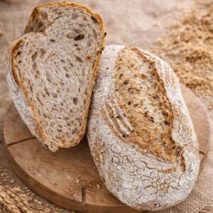 Pâine integrală de grâu cu semințe 500 g cu maia naturală și făină măcinată la moara cu pietre